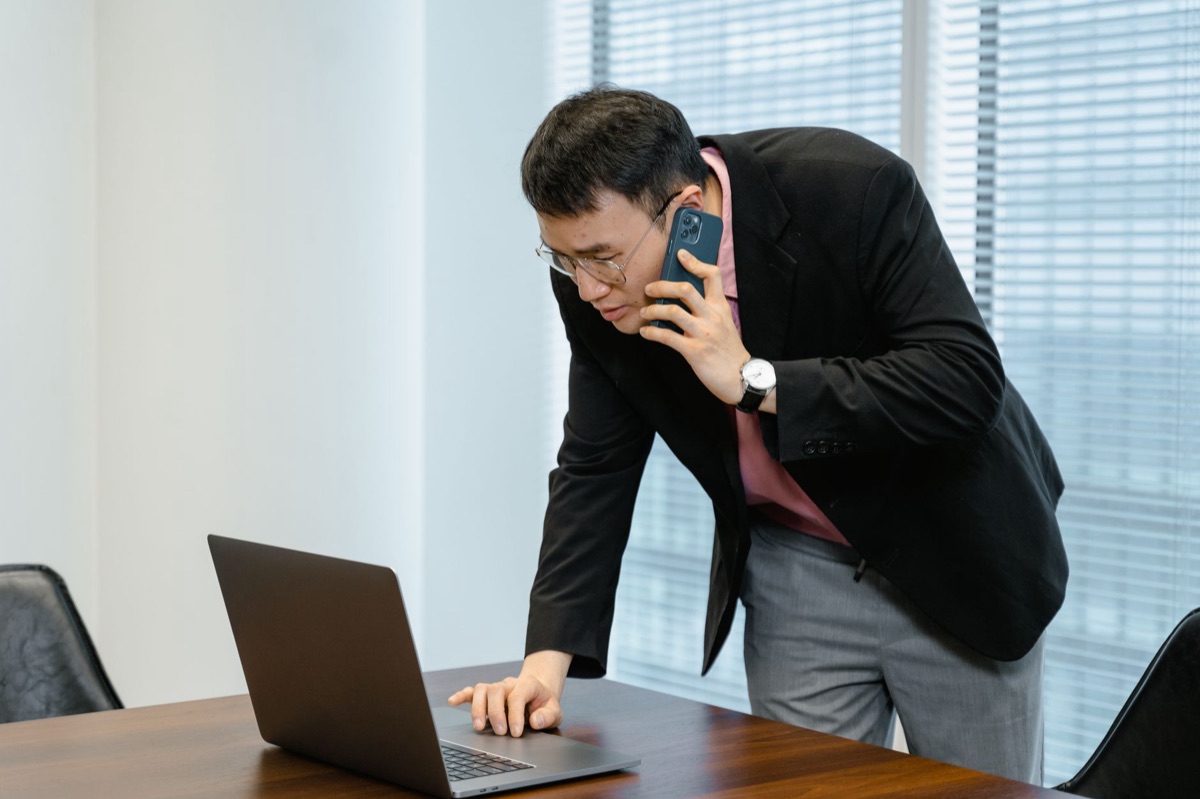 Filipino entrepreneur in office working on computer