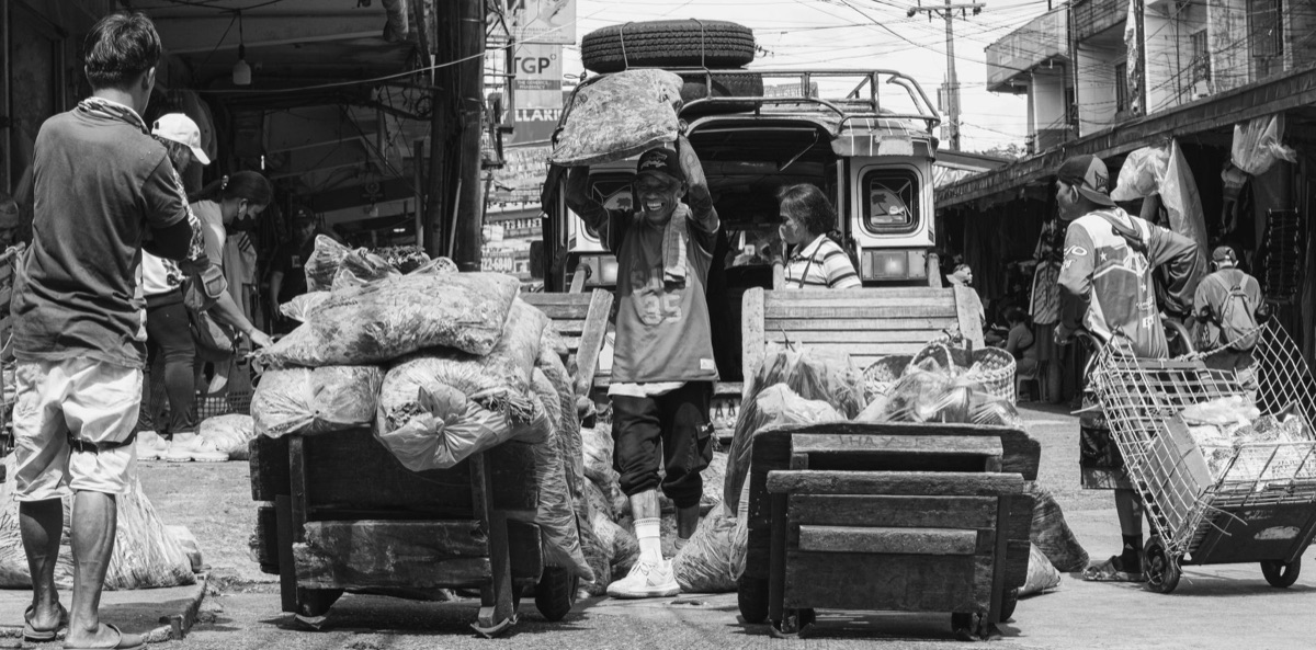 Filipino street vendor with tamales