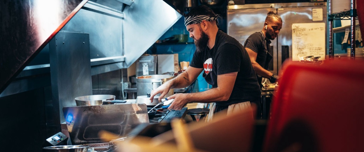 Filipino chef with sizzling lechon