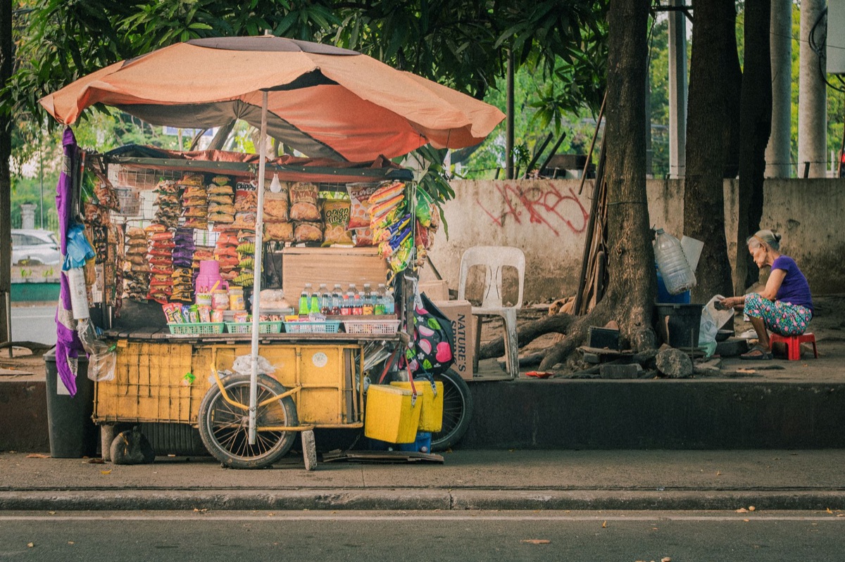 Filipino street food vendor with tamales