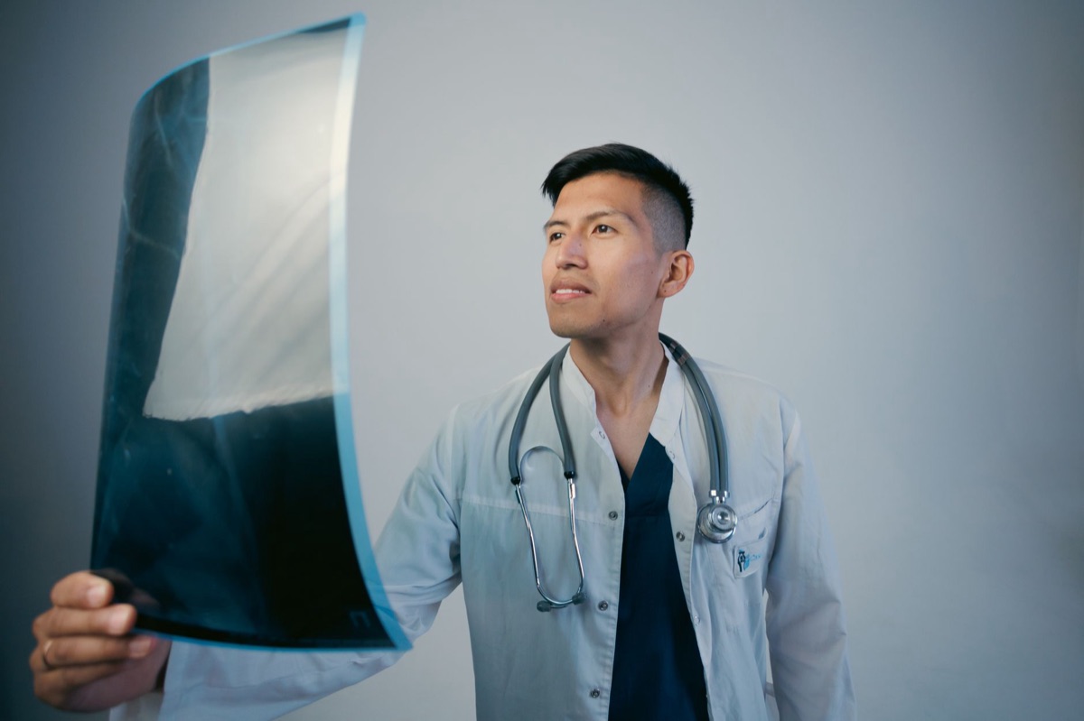 Filipino doctor with stethoscope in clinical environment