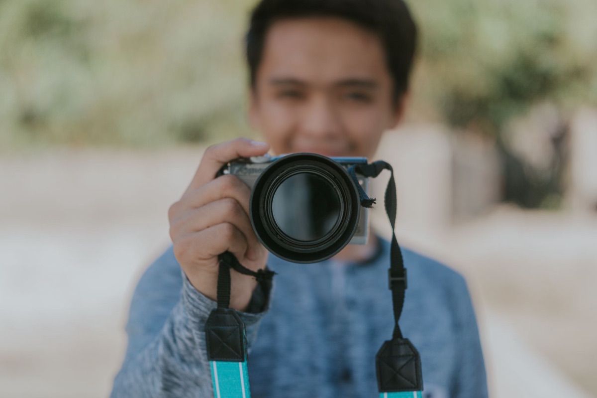 Filipino YouTuber holding a camera